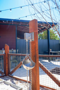 Sand Pulley on Bush Pole with stainless steel chain bucket at Charlie's Paddock playground