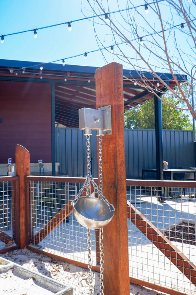 Sand Pulley on Bush Pole with stainless steel chain bucket at Charlie's Paddock playground