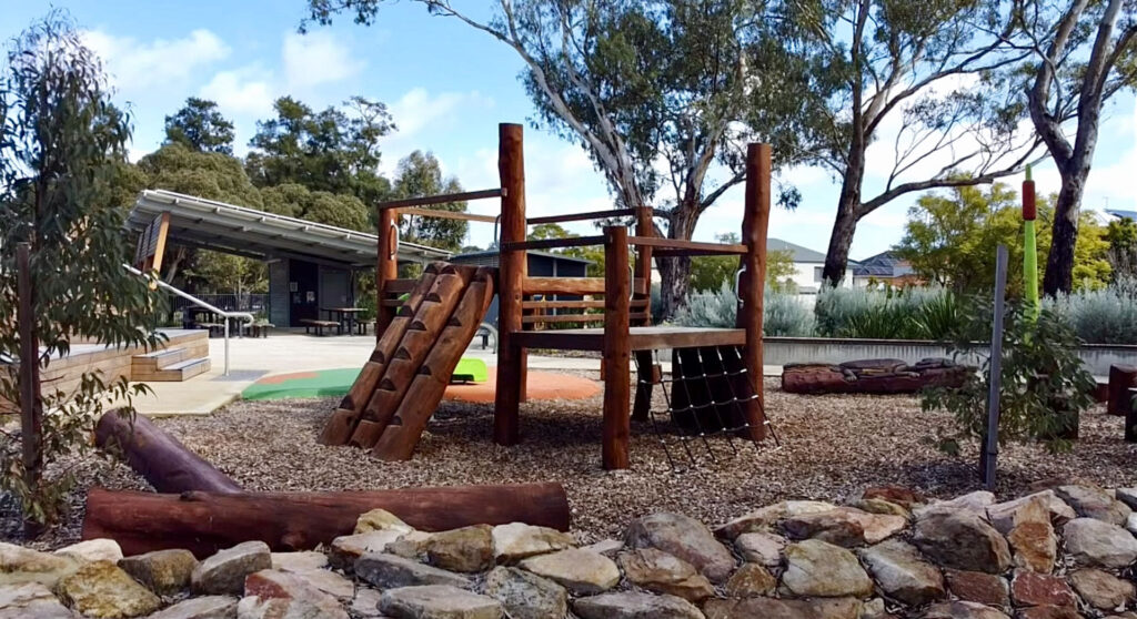 Timber nature play structure with log scramble elements at Maylands Waterland Perth, custom-fabricated by VRI