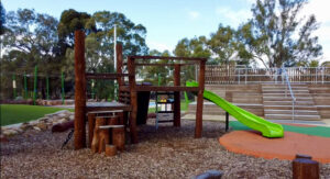 Timber nature play structure with log scramble elements at Maylands Waterland Perth, custom-fabricated by VRI