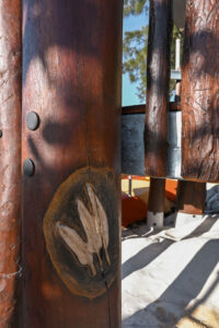 Pelican footprint carved in relief into a Jarrah structural bush pole at Shelley Beach Park playground — hand-crafted detail by Van Ryt Industries