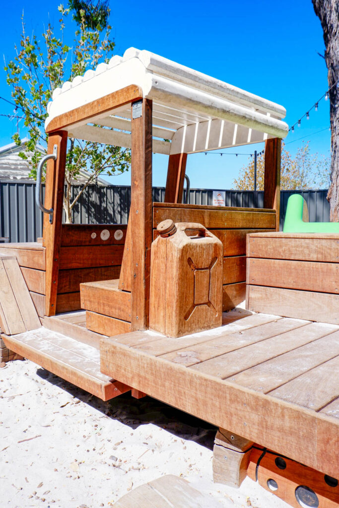 Timber Ute tray detail showing handcrafted Jarrah jerry can and cabin canopy at Charlie's Paddock playground