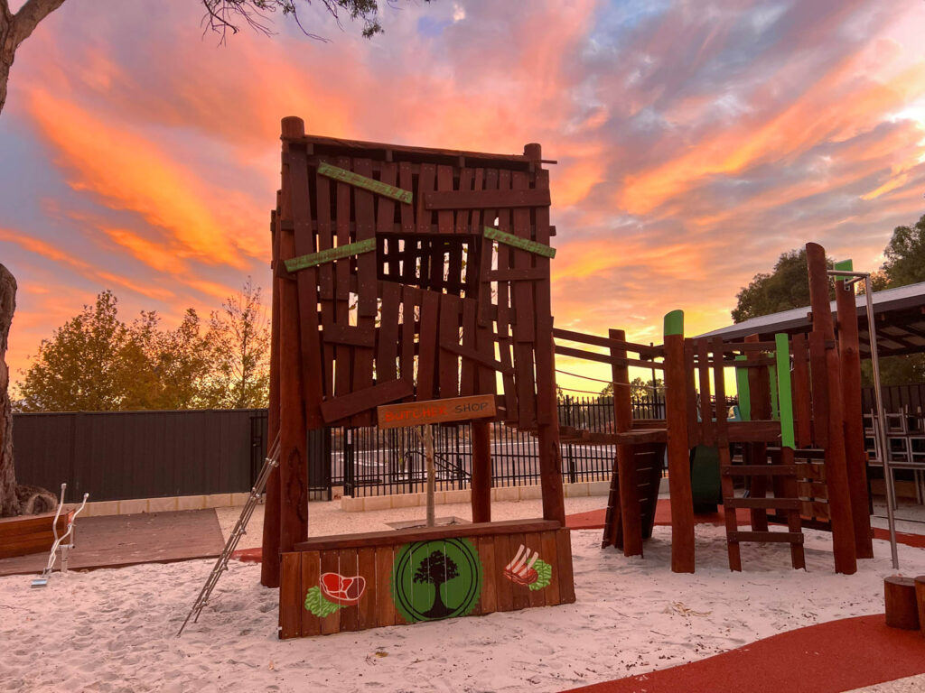 Custom treehouse cubby and playground at sunset — Charlie's Paddock playground Piara Waters