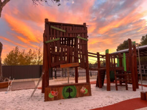 Custom treehouse cubby and playground at sunset — Charlie's Paddock playground Piara Waters