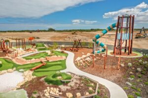 Kennedy Bay lighthouse tower playground — custom 7.7m play structure by Van Ryt Industries