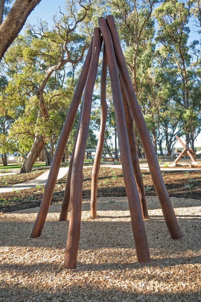 Jarrah timber bushpole teepee structure for nature play at Hathaway Reserve playground Baldivis