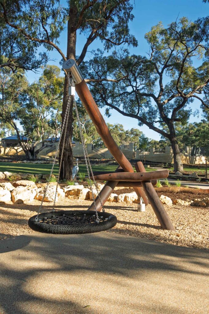 Jarrah timber cantilever pendulum swing with basket seat at Hathaway Reserve playground Baldivis, built by Van Ryt Industries
