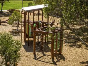 Van Ryt Industries Merredin Combo A Jarrah climbing frame — corrugated roof, coloured footholds, fireman's pole, and feature boards at Merredin WA
