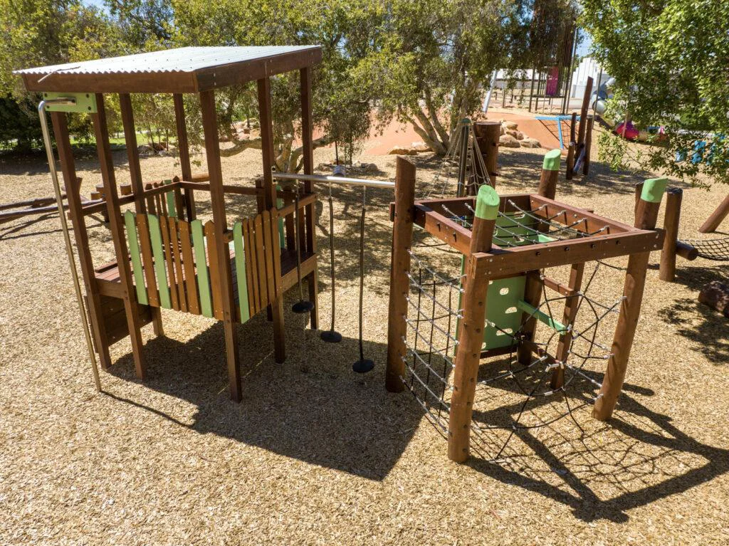 Jarrah climbing frame WA — Merredin Combo A full structure showing cubby, pommel bridge connector and rope net at Merredin park