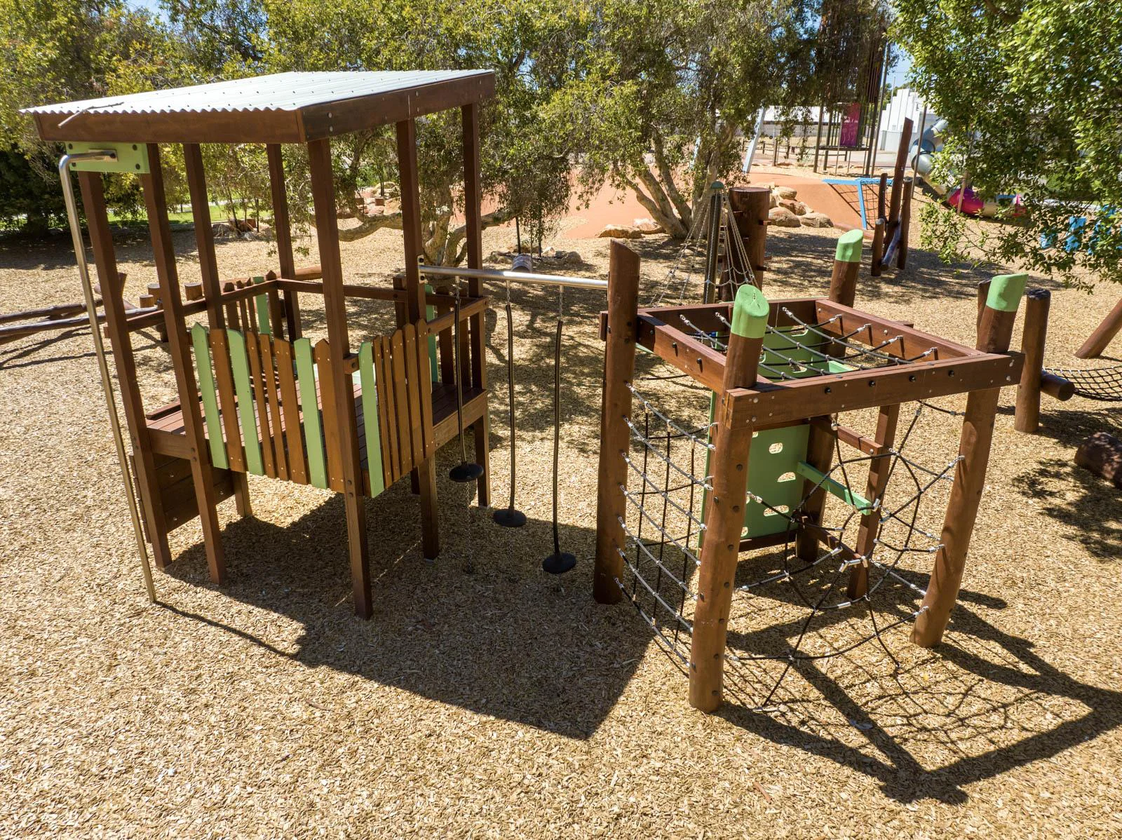 Jarrah climbing frame WA — Merredin Combo A full structure showing cubby, pommel bridge connector and rope net at Merredin park