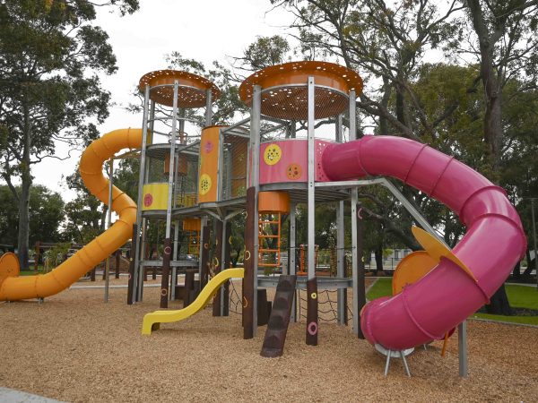 Van Ryt Industries — 148-MAN Maniana Mania Towers — Yellow Slide Angle — Maniana Park Maniana Mania Towers yellow and fuchsia slides at Maniana Park Queens Park by Van Ryt Industries